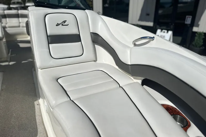 Slide: The Image of Luxurious seating on a 2007 Sea Ray 290 SLX boat, featuring sleek white upholstery. - 63
