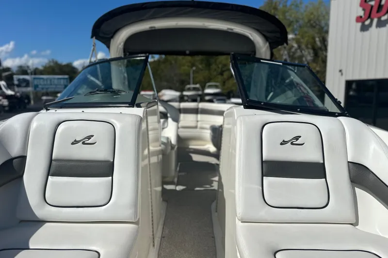Slide: The Image of 2007 Sea Ray 290 SLX boat interior with white seating and windshield. - 64