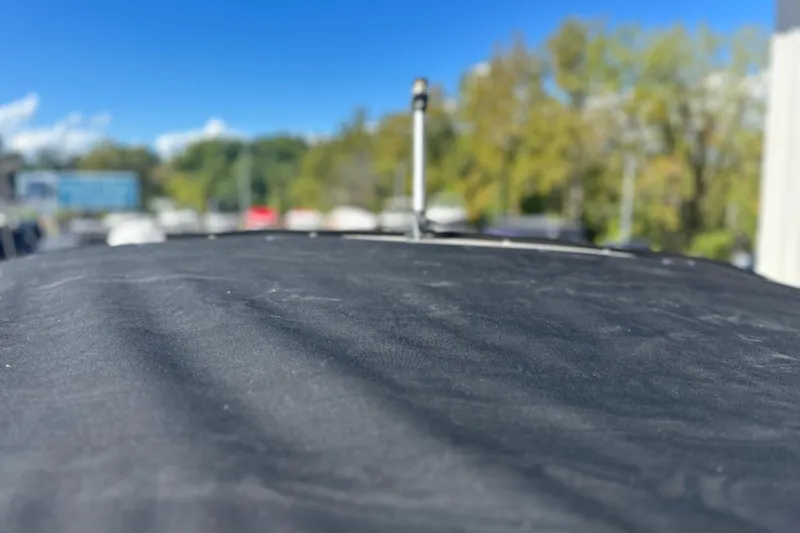 Slide: The Image of 2007 Sea Ray 290 SLX boat cover with blurred outdoor background. - 65