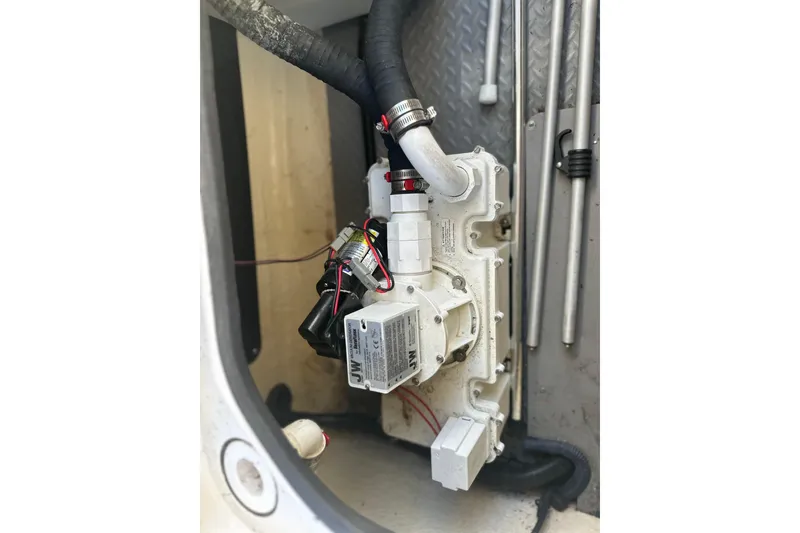 Slide: The Image of Engine compartment of 2007 Sea Ray 290 SLX with mechanical components and wiring. - 69
