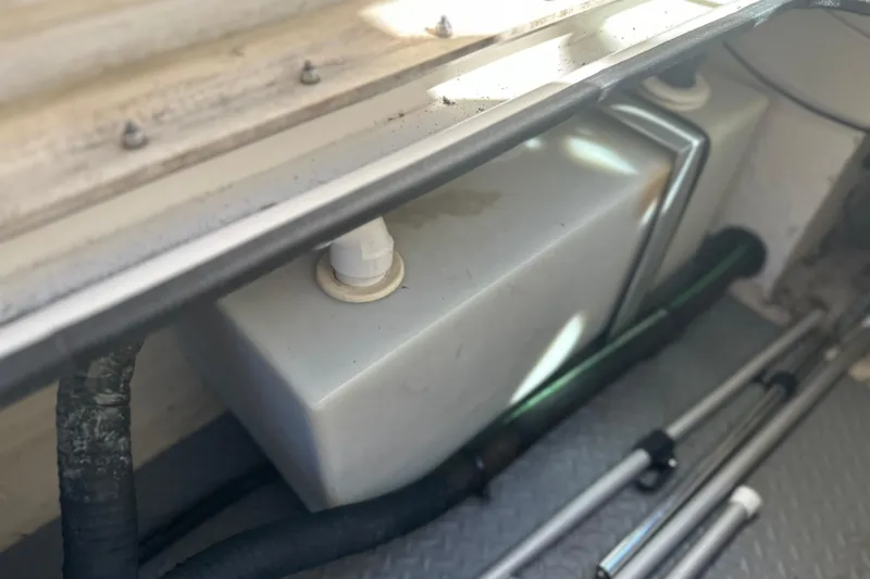 Slide: The Image of 2007 Sea Ray 290 SLX boat storage compartment with equipment and tank. - 70