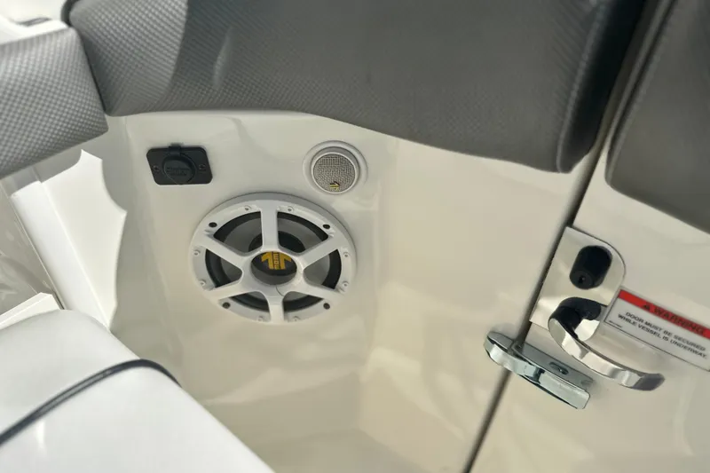 Slide: The Image of Interior of 2007 Sea Ray 290 SLX boat showing speaker and door handle. - 72
