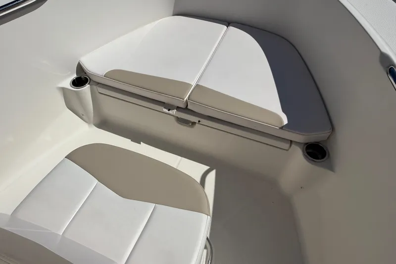 Slide: The Image of 2020 Robalo R180 Center Console boat seating area with cup holders. - 11