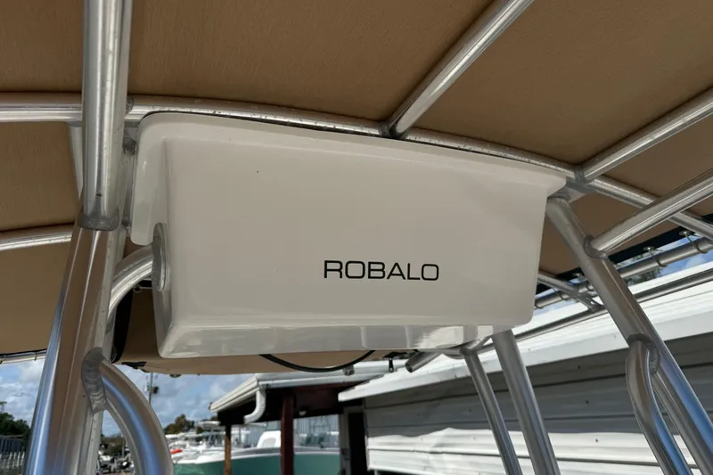 Slide: The Image of 2020 Robalo R180 Center Console boat canopy with logo, featuring sturdy metal framework. - 12