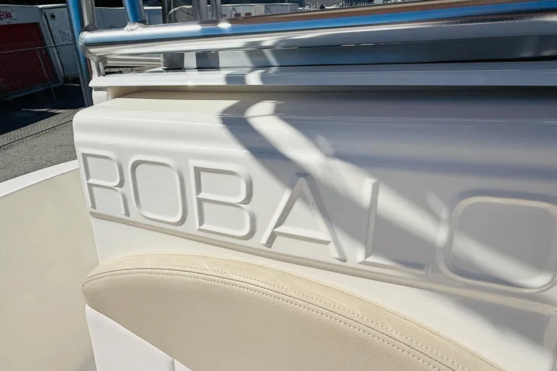 Slide: The Image of 2020 Robalo R180 Center Console boat with embossed logo detail. - 13