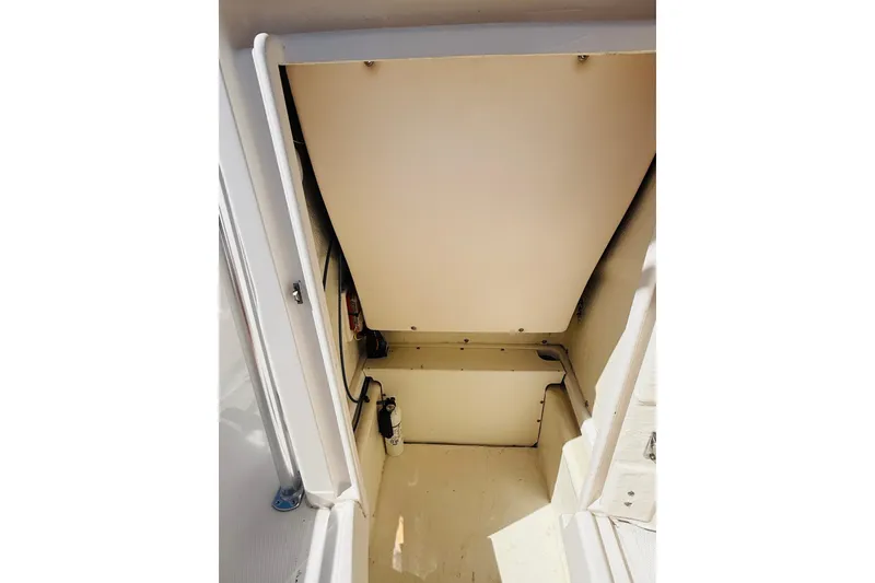 Slide: The Image of 2020 Robalo R180 Center Console storage compartment interior view. - 14