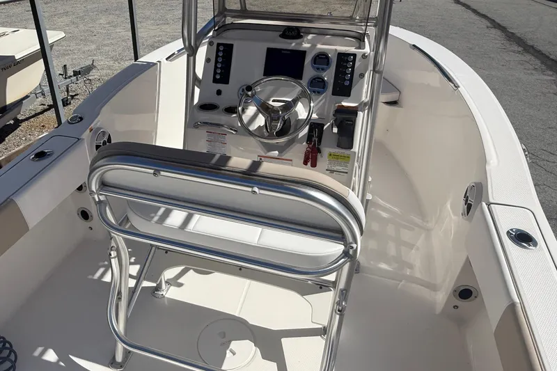 Slide: The Image of 2020 Robalo R180 Center Console boat interior with steering wheel and controls. - 4
