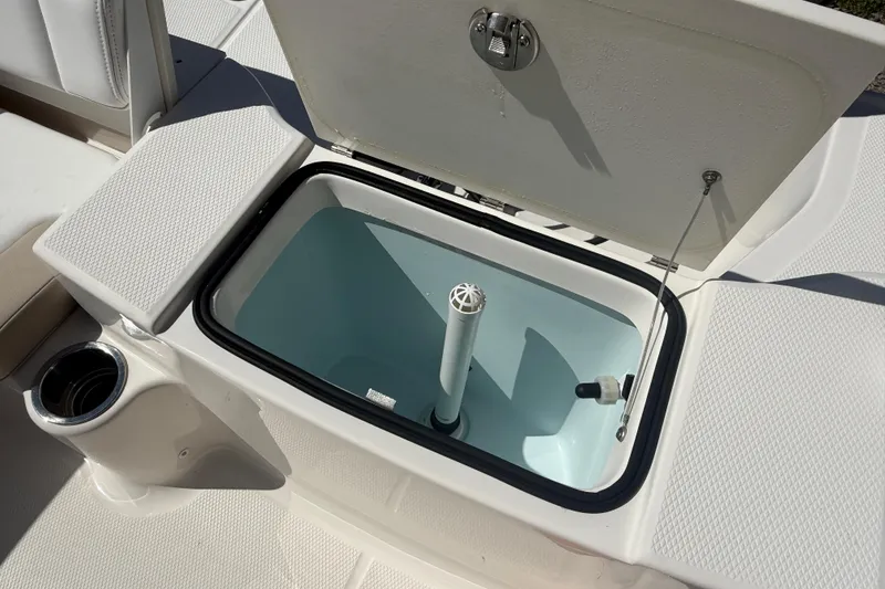 Slide: The Image of Open storage compartment on 2020 Robalo R180 Center Console boat. - 6