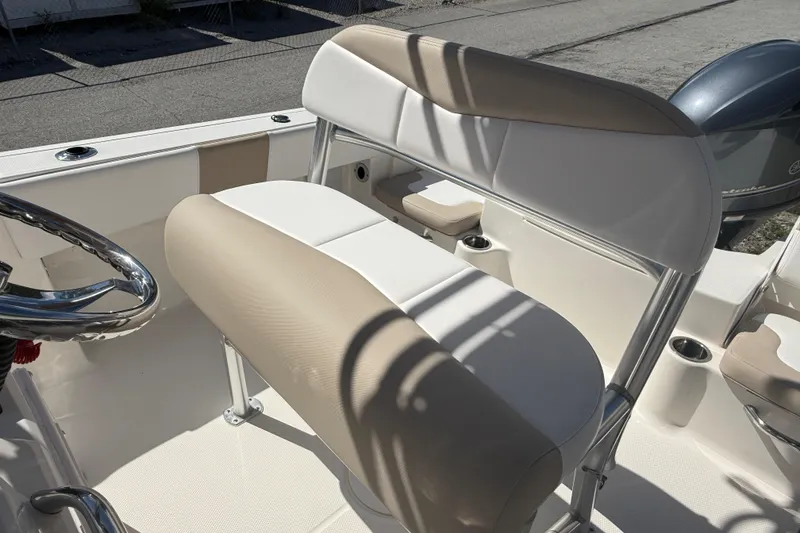 Slide: The Image of 2020 Robalo R180 Center Console boat interior with beige and white seating. - 7