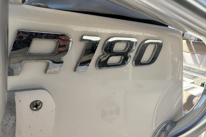 Slide: The Image of Chrome "R180" emblem on 2020 Robalo Center Console boat. - 8