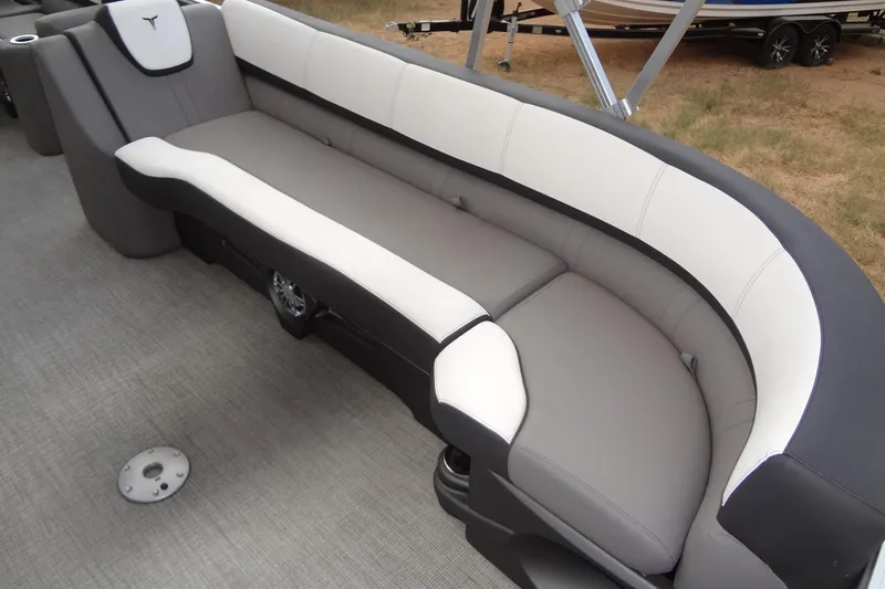 Slide: The Image of 2024 Tahoe Pontoon 2585 VRL boat seating, featuring sleek gray and white upholstery. - 12