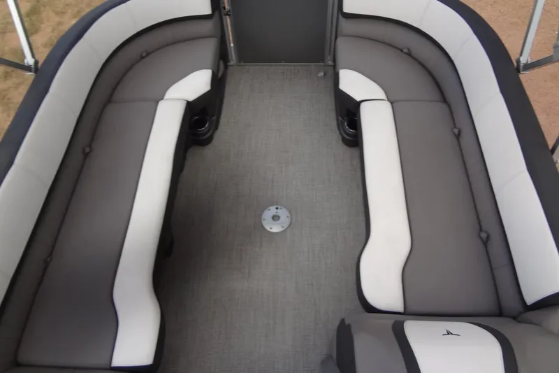 Slide: The Image of 2024 Tahoe Pontoon 2585 VRL interior with gray and white seating arrangement. - 13