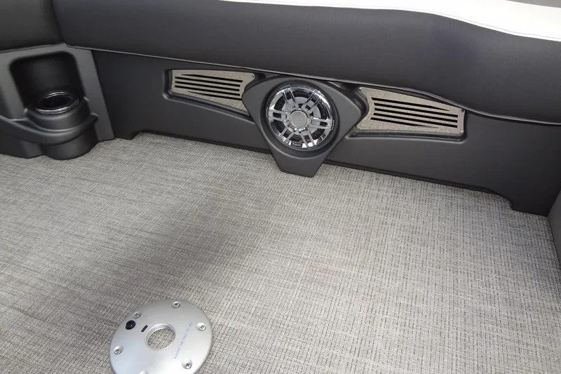 Slide: The Image of 2024 Tahoe Pontoon 2585 VRL interior with speaker and textured flooring. - 14