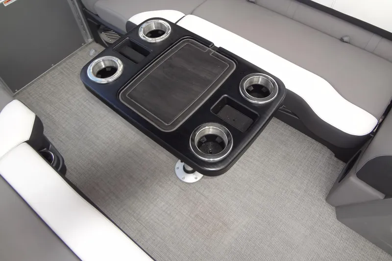 Slide: The Image of 2024 Tahoe Pontoon 2585 VRL interior with table and cup holders. - 16