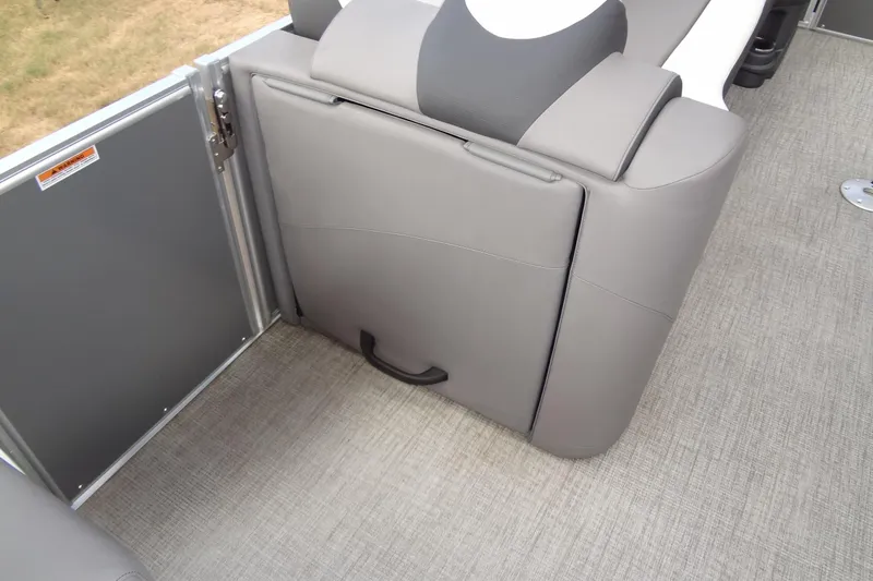 Slide: The Image of 2024 Tahoe Pontoon 2585 VRL interior seating with gray upholstery and storage compartment. - 20