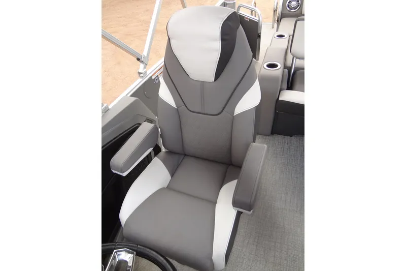Slide: The Image of 2024 Tahoe Pontoon 2585 VRL captain's chair, featuring sleek gray and white design. - 24