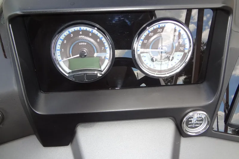 Slide: The Image of Dashboard of 2024 Tahoe Pontoon 2585 VRL with RPM and speed gauges. - 27