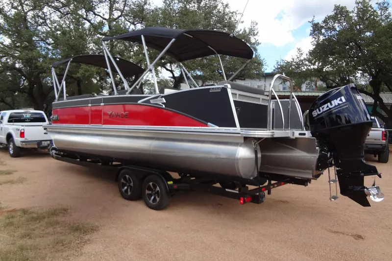 Slide: The Image of 2024 Tahoe Pontoon 2585 VRL with Suzuki outboard motor on trailer. - 3