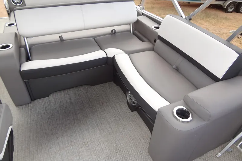 Slide: The Image of 2024 Tahoe Pontoon 2585 VRL interior seating with cup holders and modern design. - 30