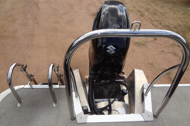 Slide: The Image of 2024 Tahoe Pontoon 2585 VRL with Suzuki outboard motor, rear view. - 36