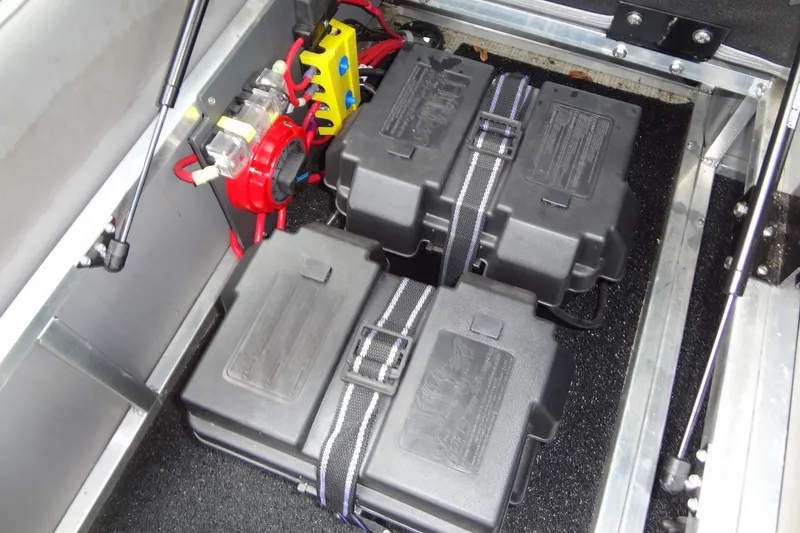 Slide: The Image of 2024 Tahoe Pontoon 2585 VRL battery compartment with dual batteries and wiring. - 37