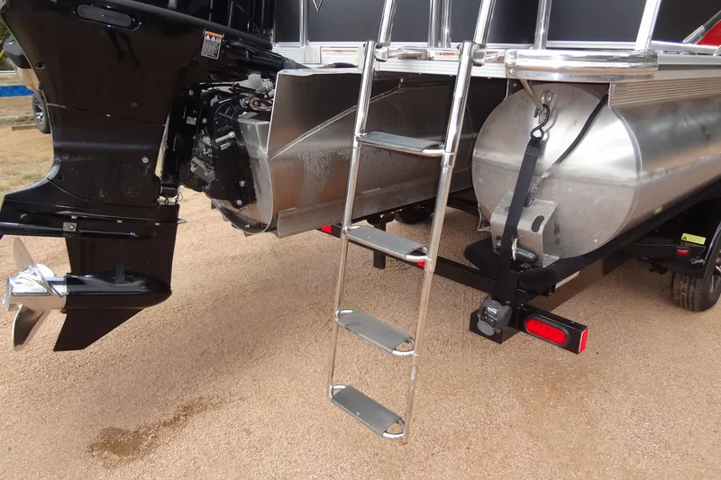 Slide: The Image of 2024 Tahoe Pontoon 2585 VRL rear view with ladder and motor details. - 40