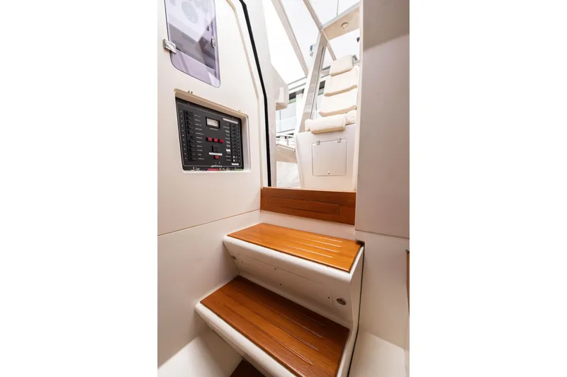 Slide: The Image of Interior of 2005 Wally Yachts Tender Express with wooden steps and control panel. - 12