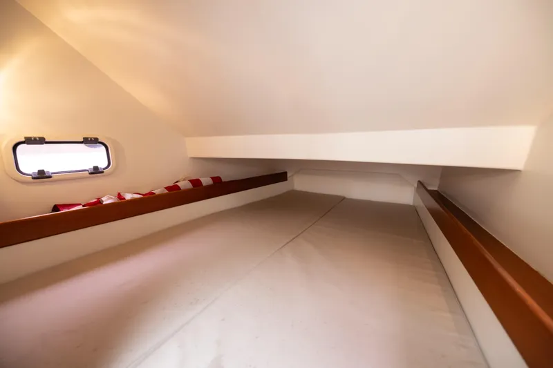 Slide: The Image of Interior cabin of 2005 Wally Yachts Tender Express, featuring a cozy sleeping area. - 14