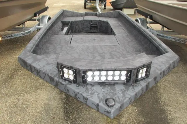 Slide: The Image of 2026 Reaper Boats 656-1689 model with camouflage design and LED lights on trailer. - 4