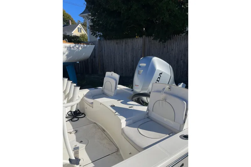 Slide: The Image of 2021 Sea Born FX21 Bay boat interior with Honda outboard motor. - 4