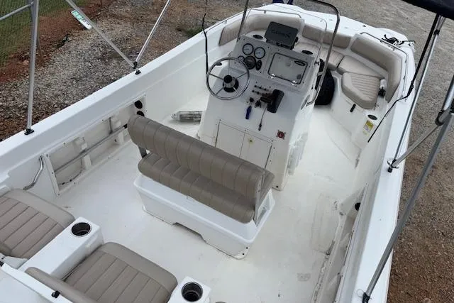 Slide: The Image of 2011 NauticStar 210 Coastal boat interior with seating and control panel. - 12