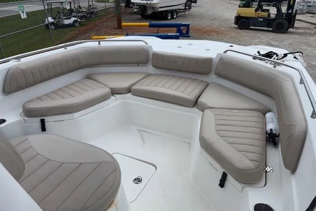 Slide: The Image of 2011 NauticStar 210 Coastal boat with spacious seating area and beige cushions. - 16