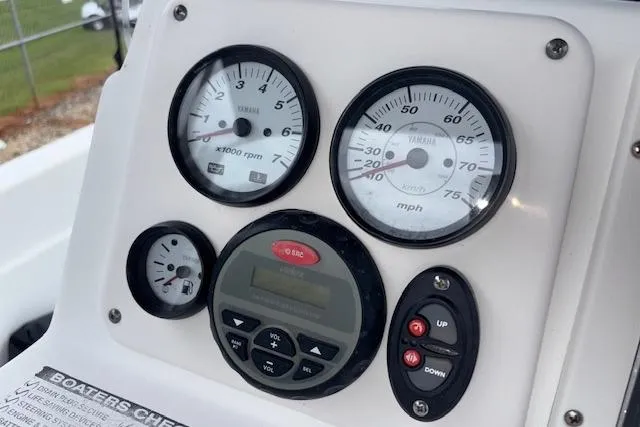 Slide: The Image of Dashboard of 2011 NauticStar 210 Coastal boat with gauges and controls. - 19