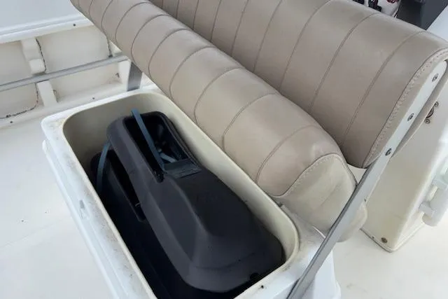 Slide: The Image of 2011 NauticStar 210 Coastal boat seat with storage compartment open. - 22