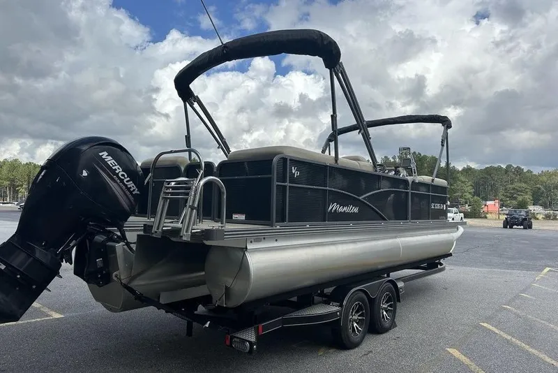Slide: The Image of 2018 Manitou 23 Aurora LE RF pontoon boat with Mercury outboard motor on trailer. - 3