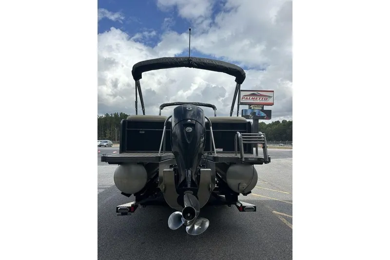 Slide: The Image of 2018 Manitou 23 Aurora LE RF pontoon boat, rear view with outboard motor. - 4