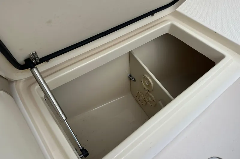 Slide: The Image of Open storage compartment on 2012 Grady-White Freedom 275 boat. - 12
