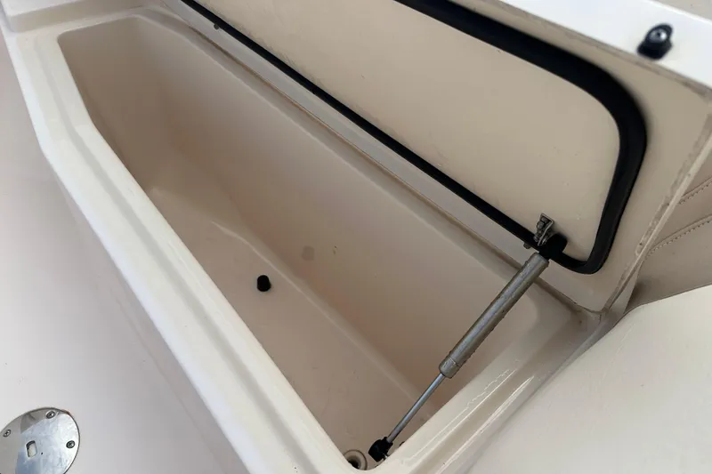 Slide: The Image of Open storage compartment on a 2012 Grady-White Freedom 275 boat. - 13