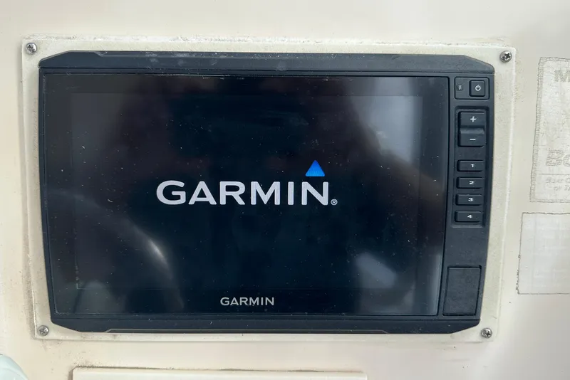 Slide: The Image of Garmin display on 2012 Grady-White Freedom 275 boat dashboard. - 25