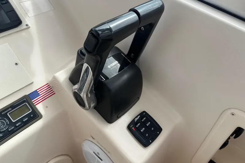 Slide: The Image of Control panel of a 2012 Grady-White Freedom 275 boat with Yamaha throttle. - 28