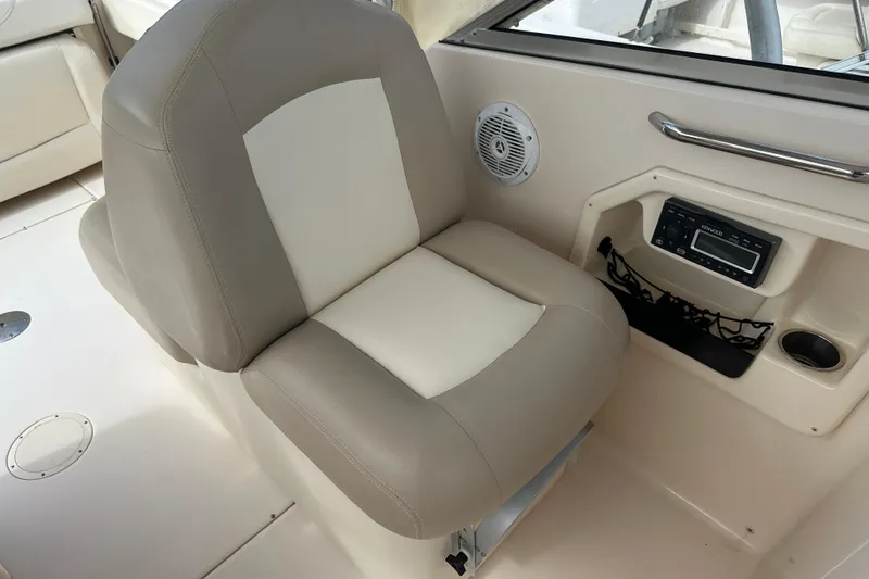 Slide: The Image of Grady-White Freedom 275 boat interior, featuring a comfortable seat and audio system, 2012 model. - 31