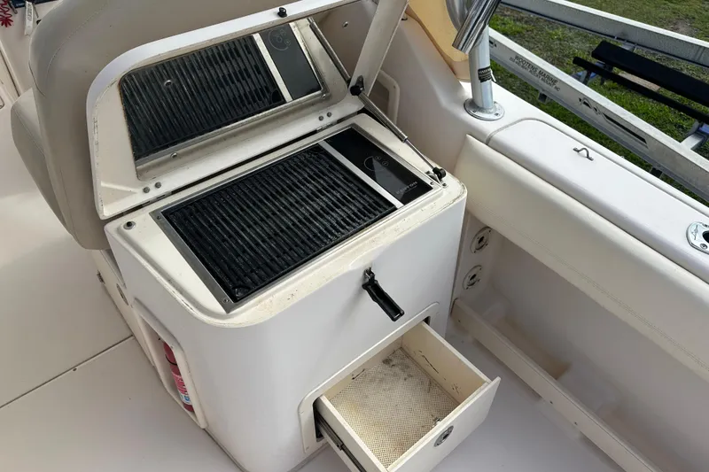 Slide: The Image of Grady-White Freedom 275 boat interior with grill and storage drawer, 2012 model. - 33