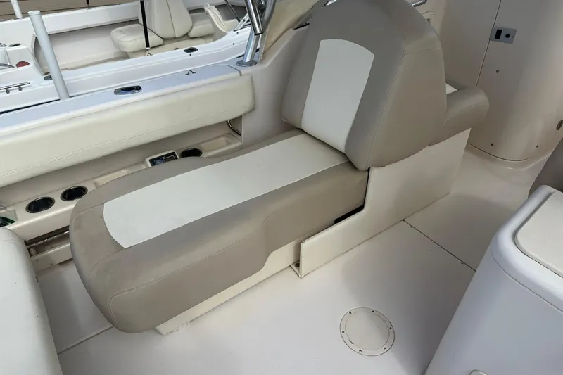Slide: The Image of 2012 Grady-White Freedom 275 boat interior with beige and white seating. - 35