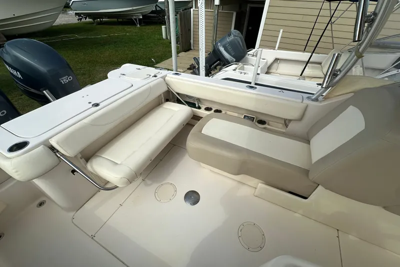 Slide: The Image of 2012 Grady-White Freedom 275 boat interior with seating and Yamaha engines. - 36