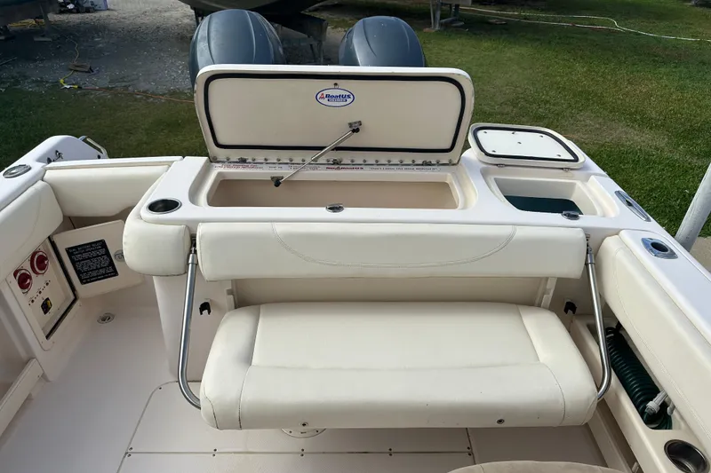 Slide: The Image of 2012 Grady-White Freedom 275 boat interior with seating and storage compartments. - 38
