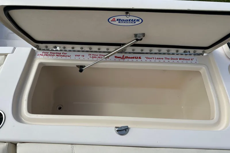 Slide: The Image of Open storage compartment on 2012 Grady-White Freedom 275 boat with TowBoatUS sticker. - 39