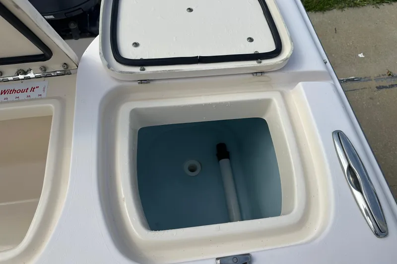 Slide: The Image of Open storage compartment on a 2012 Grady-White Freedom 275 boat. - 40