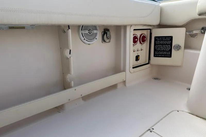 Slide: The Image of 2012 Grady-White Freedom 275 boat interior with battery switch panel and speaker. - 41