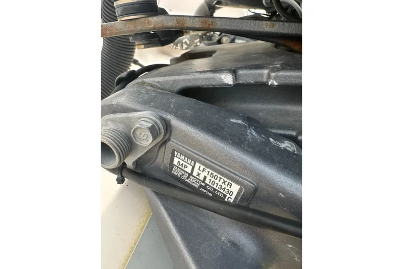Slide: The Image of Close-up of Yamaha engine part on 2012 Grady-White Freedom 275 boat. - 9