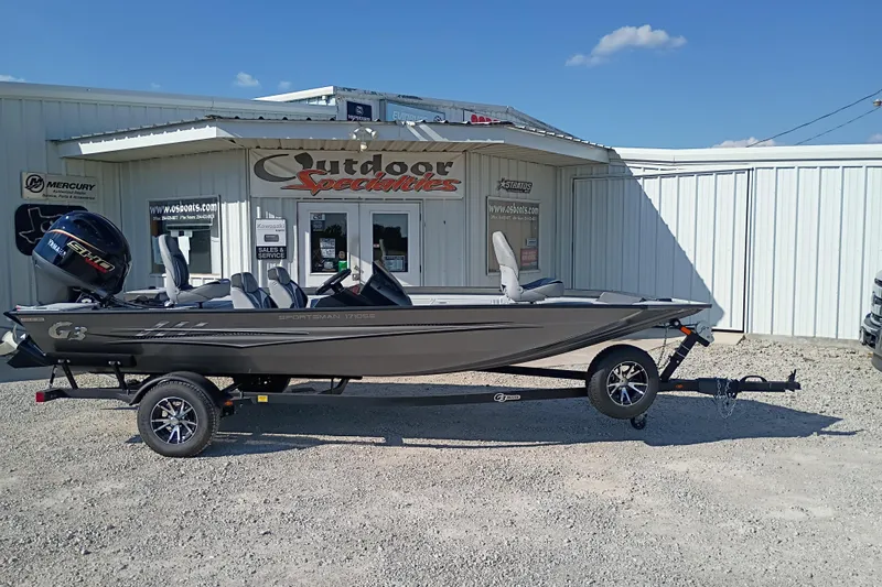 The Image of 2026 G3 1710SE boat on trailer outside Outdoor Specialties store. - 1